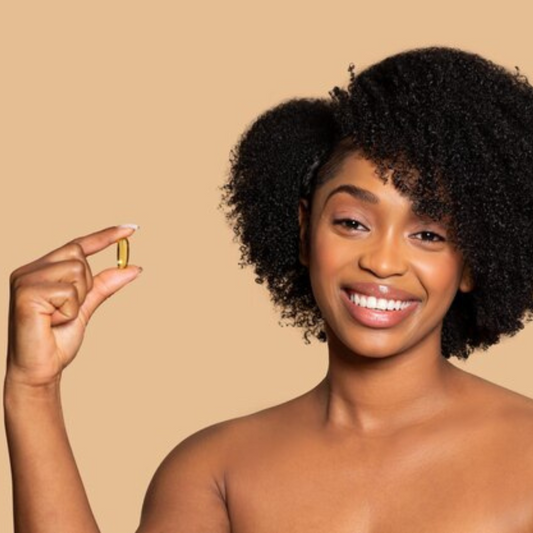 Afro-textured hair woman with Vitamin D supplement